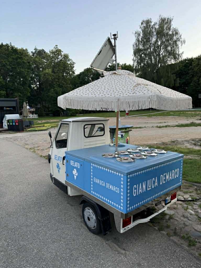 Piaggio Ape 50 gelato truck with 24 stainless steel ice cream pans on display